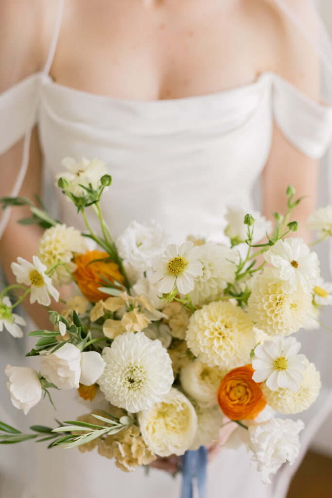 Bridal bouquet of white and orange flowers for an elegant Destination Wedding in Italy celebration.