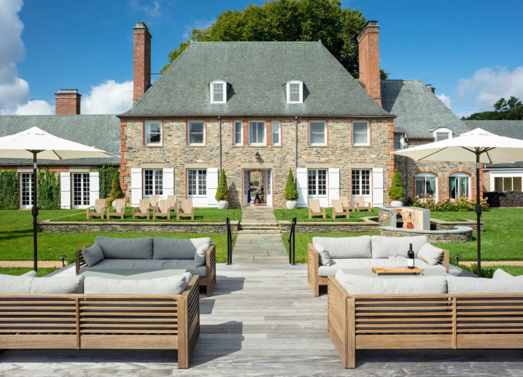 Elegant stone estate with outdoor seating, one of the best intimate wedding venues in Rhode Island.