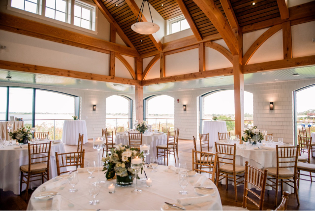 Bright waterfront reception space with exposed beams, one of the best intimate wedding venues in Rhode Island.