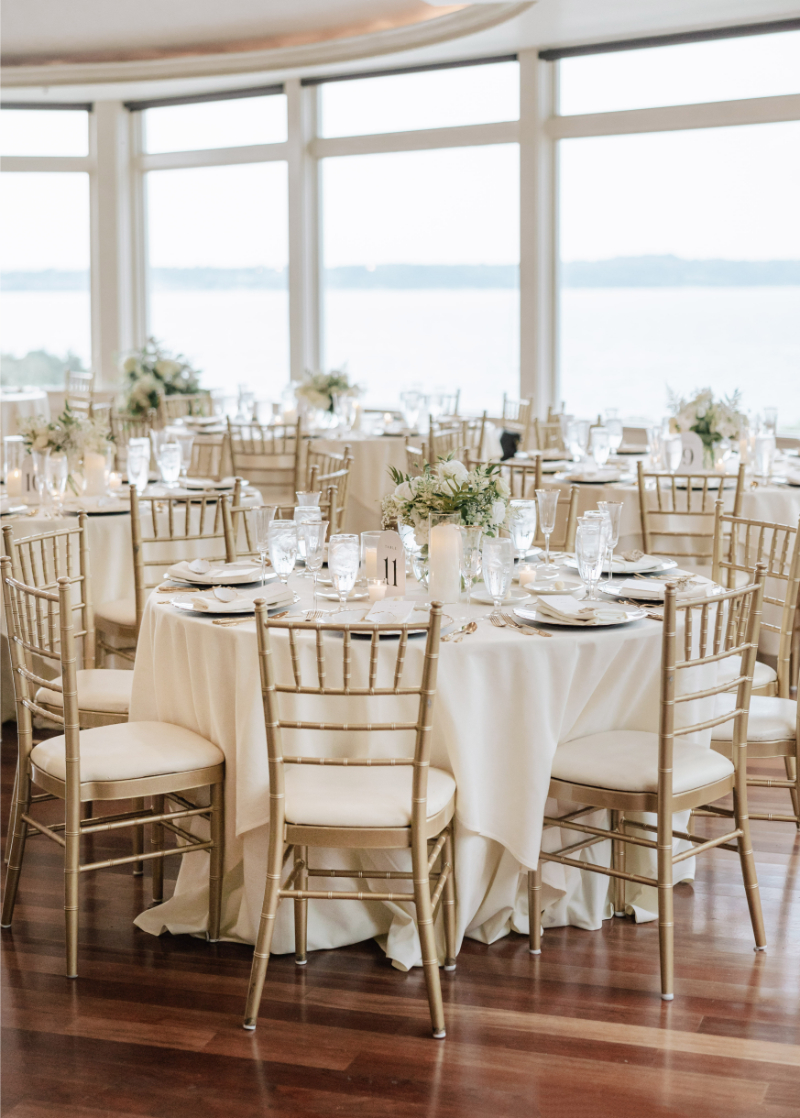 Elegant indoor reception with gold chairs and soft florals, showcasing one of the best intimate wedding venues.