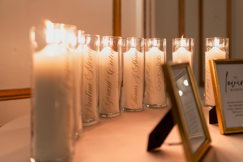 Memorial candles honoring loved ones, thoughtfully included as part of creating an inclusive wedding experience.