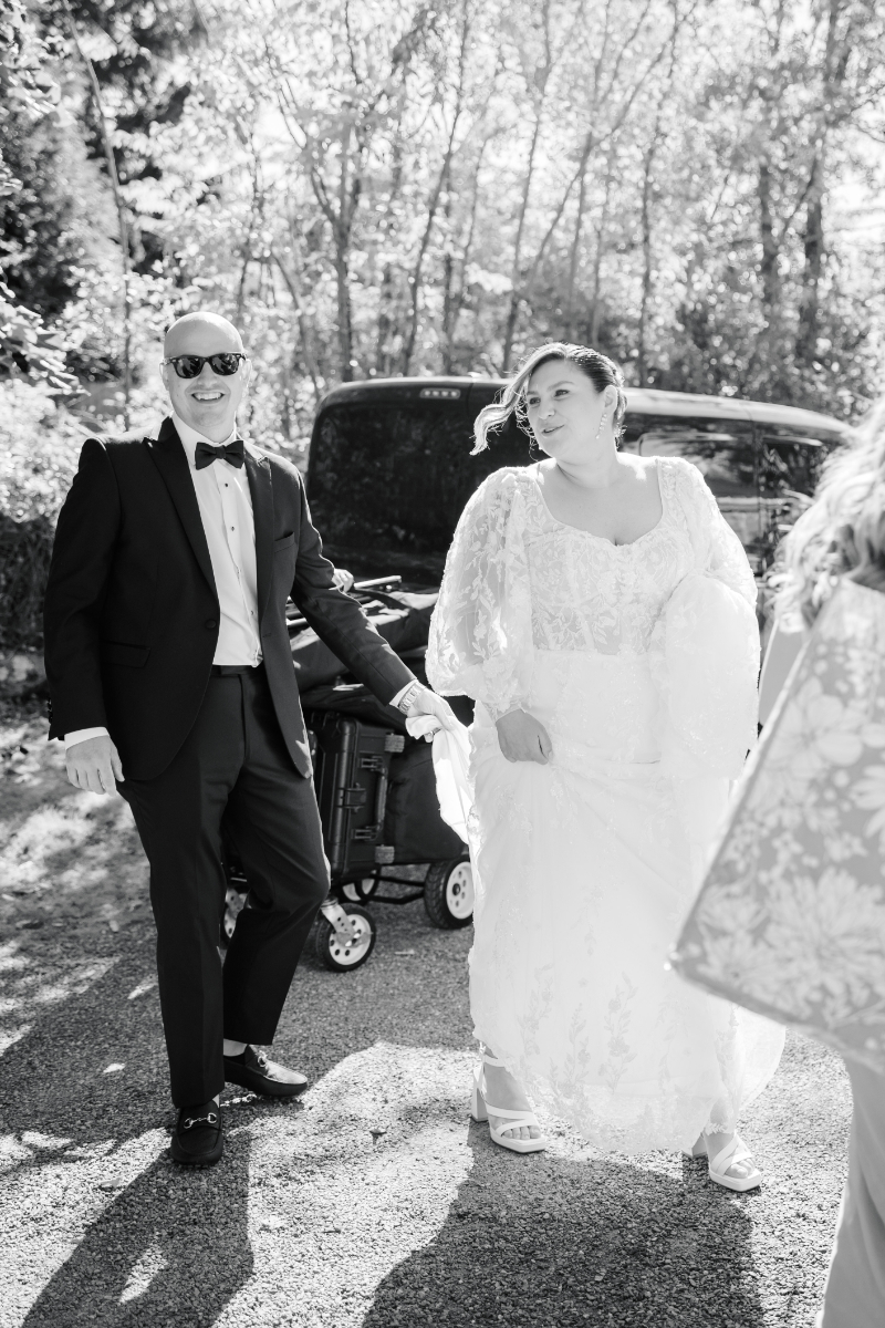 Bride and groom smiling together outdoors in black and white portrait at Blithewold Mansion wedding