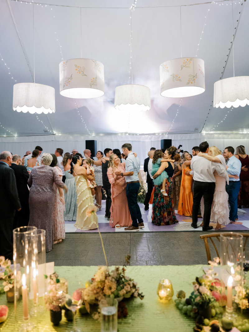 Guests dancing under hanging drum  at a Blithewold Mansion wedding