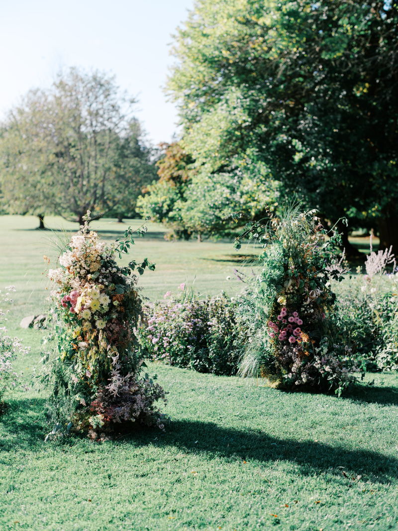 Blithewold Mansion wedding garden ceremony with lush floral aisle installations.
