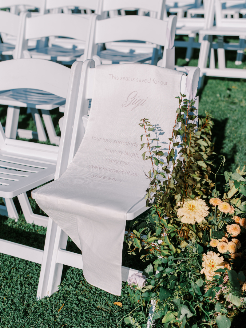 Blithewold Mansion wedding reserved ceremony chair with floral aisle details.