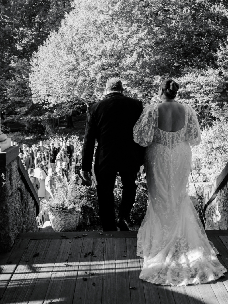Blithewold Mansion wedding bride and groom walking to garden ceremony.