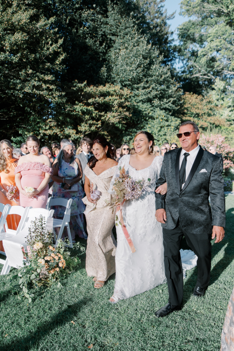 Blithewold Mansion wedding bride walking down garden aisle with parents.