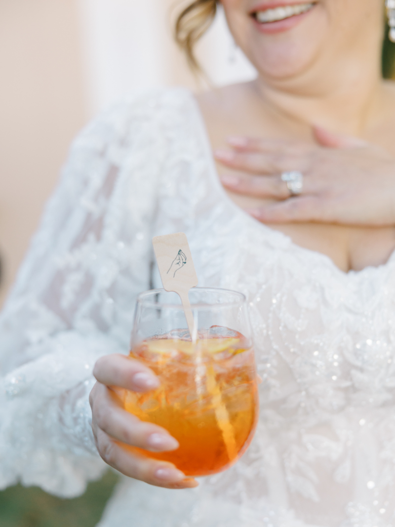 Blithewold Mansion wedding Aperol spritz with custom stir stick at cocktail hour.