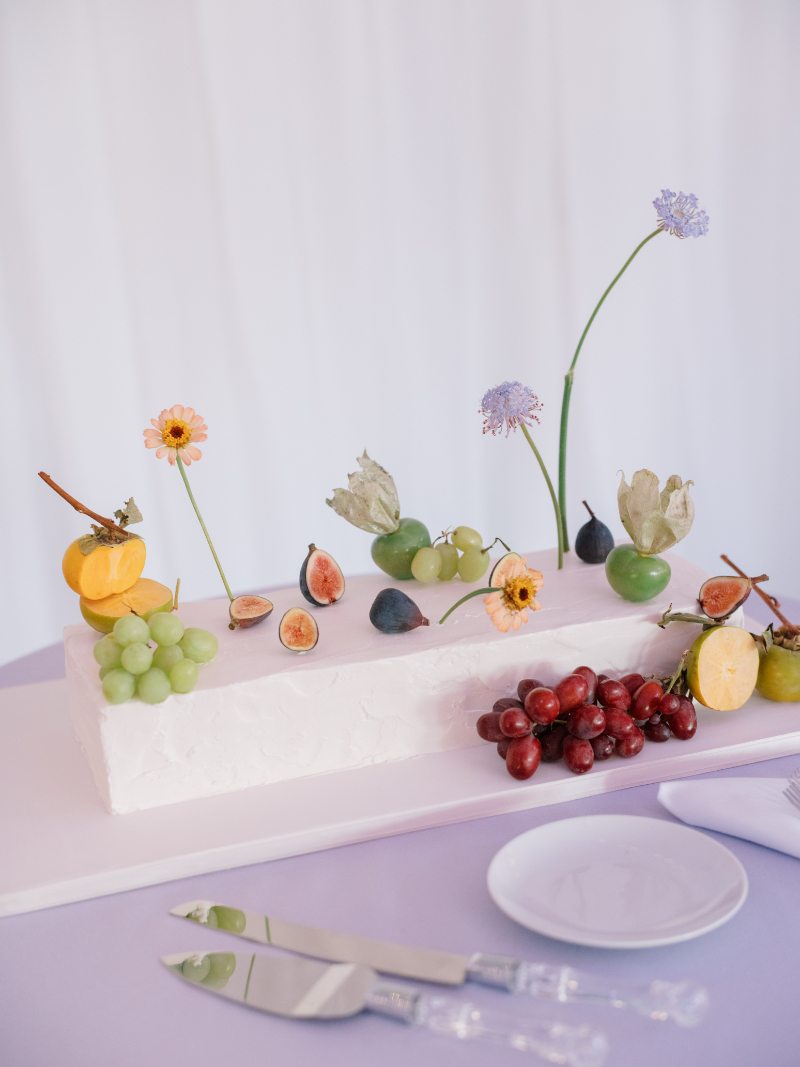 Blithewold Mansion wedding rectangular cake with pastel icing, fresh fruit, and floral details.