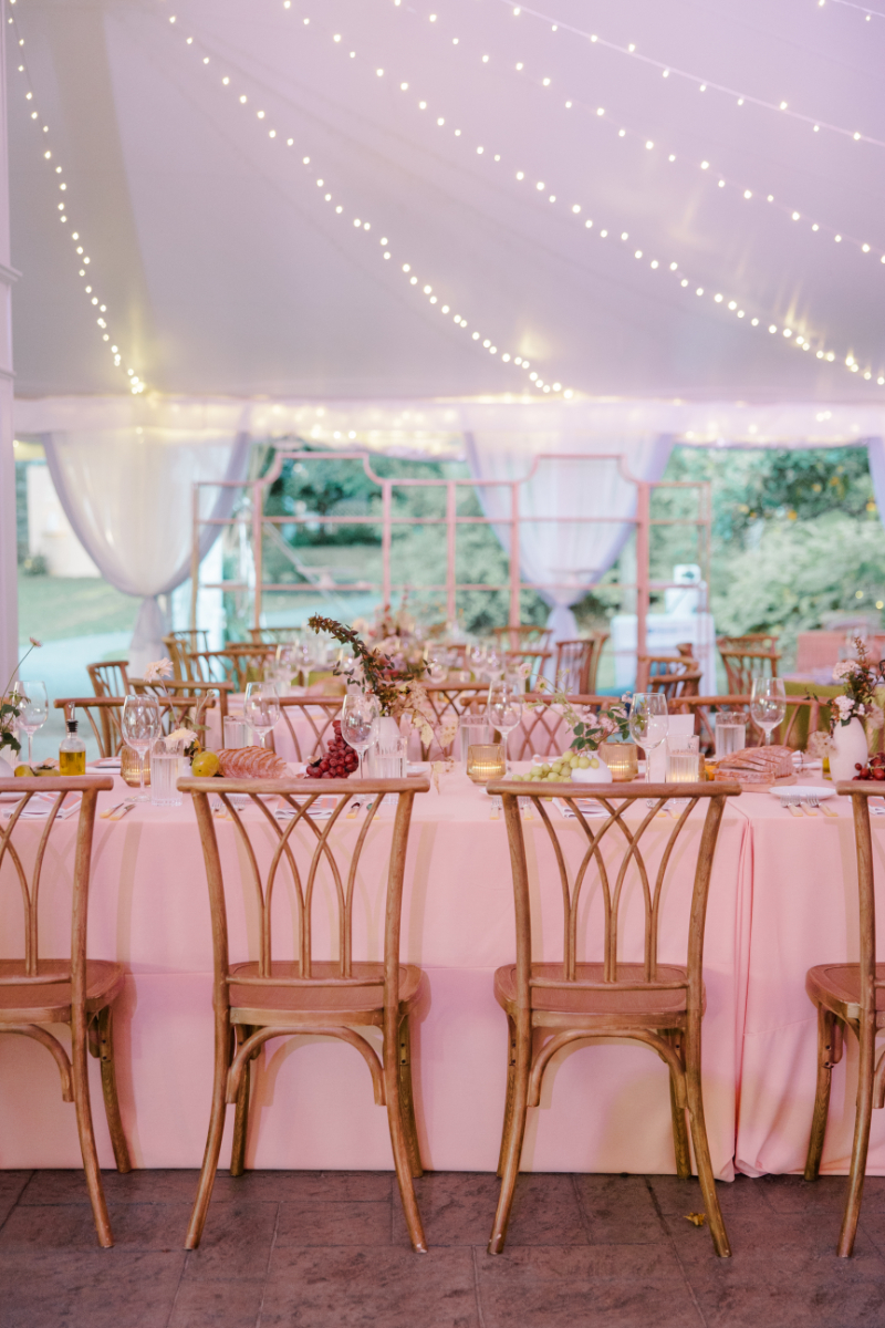 Blithewold Mansion wedding reception table with soft pink linen and candlelit florals.