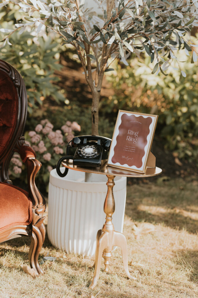Vintage card table display during Italian countryside wedding cocktail hour outdoors.