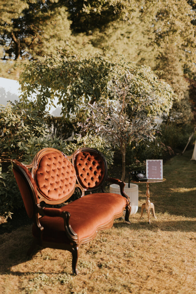 Vintage lounge seating setup at Italian countryside wedding reception.