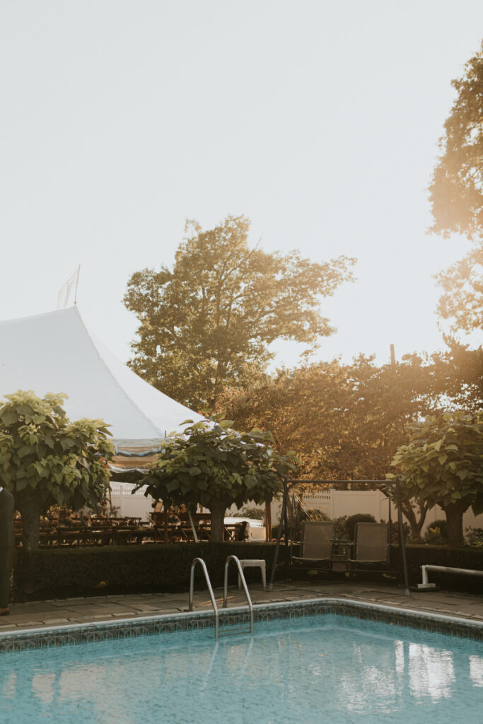 Pool and tented reception setup 