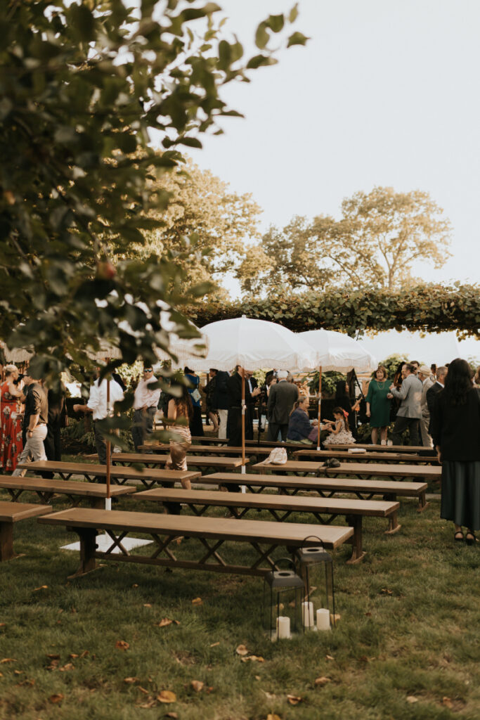 Ceremony benches set on lawn at a wedding 