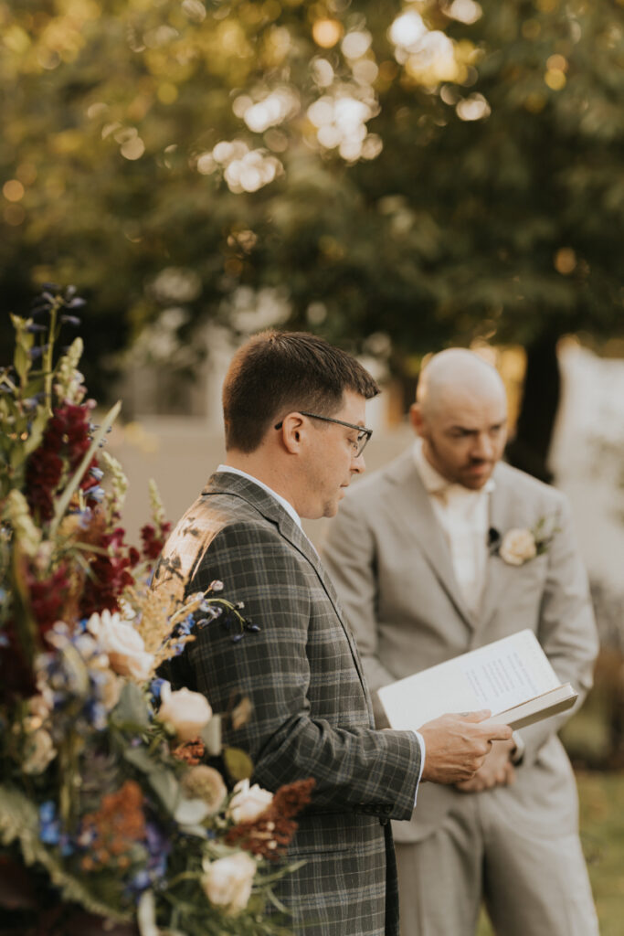 Officiant leading outdoor ceremony during Italian countryside wedding at family estate.