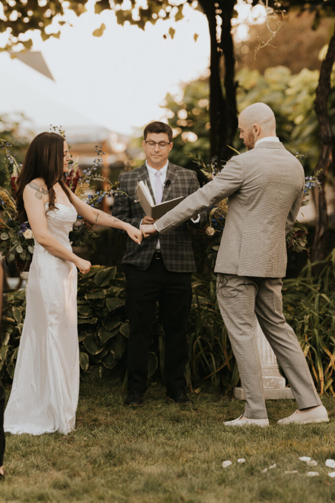 Cocktail detail on wooden table during Italian countryside wedding reception.