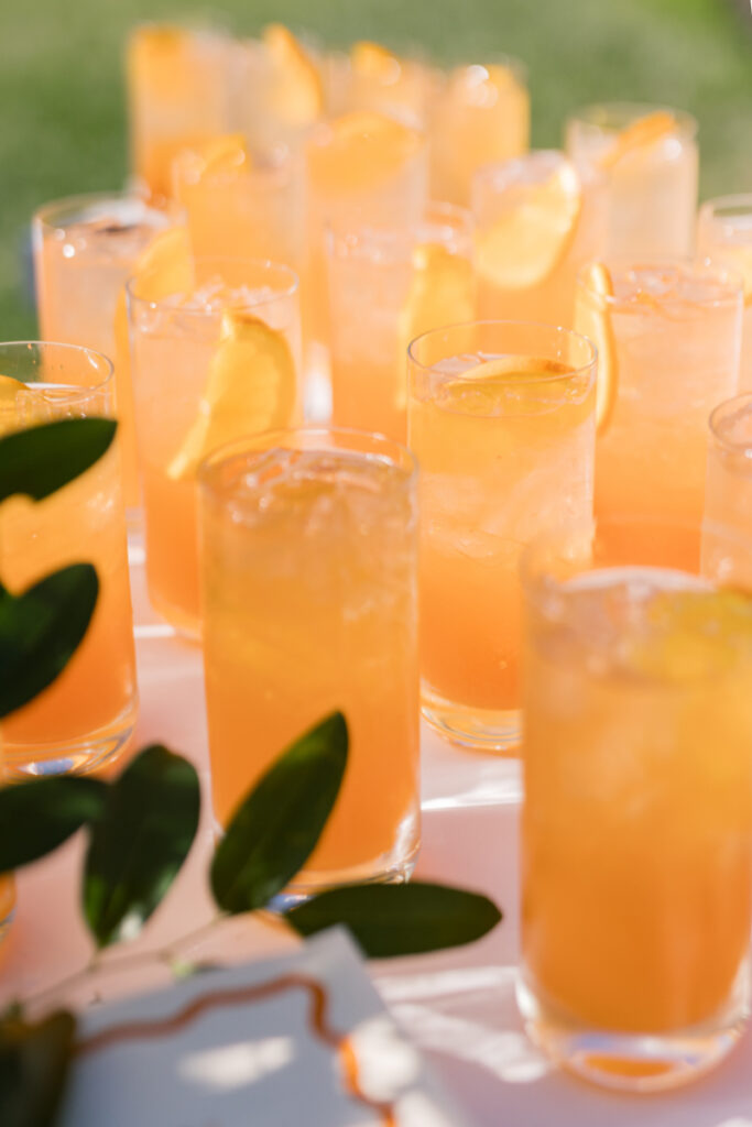 Aperol spritz cocktails served during golden hour at an outdoor wedding at Connemara House.