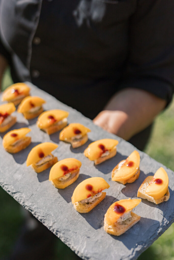 Peach crostini appetizers served during cocktail hour at an Italian-inspired wedding at Connemara House.