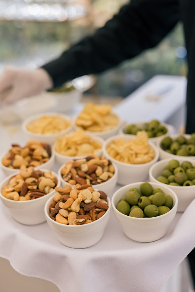 Citrus signature cocktail sign and florals at a colorful summer wedding at Connemara House.