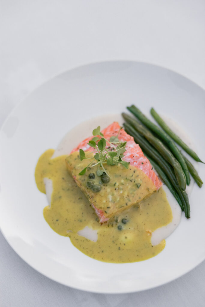 Mobile espresso and affogato cart set up under a tent with romantic string lighting.