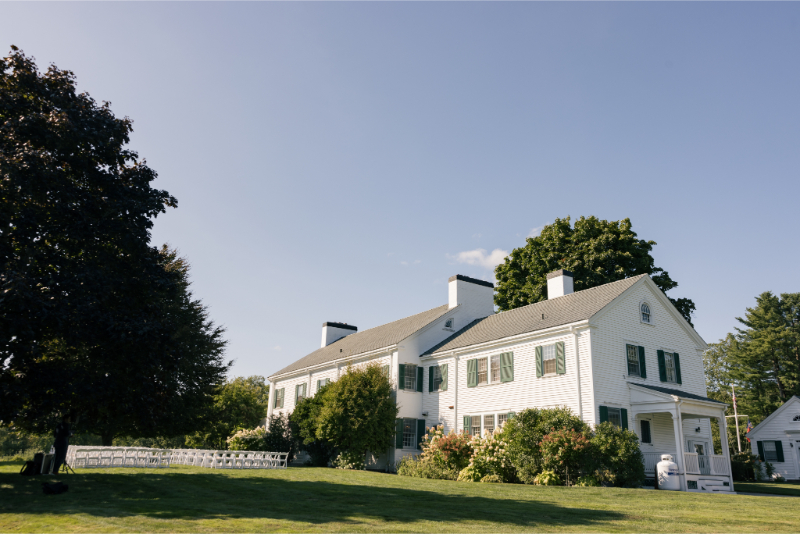 Sunny outdoor ceremony setup on the lawn for a wedding at Connemara House in Massachusetts.