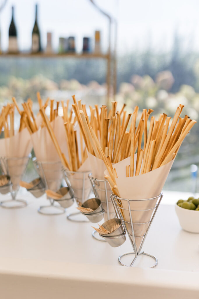 Cozy outdoor lounge and cocktail tables on the lawn at a wedding at Connemara House.