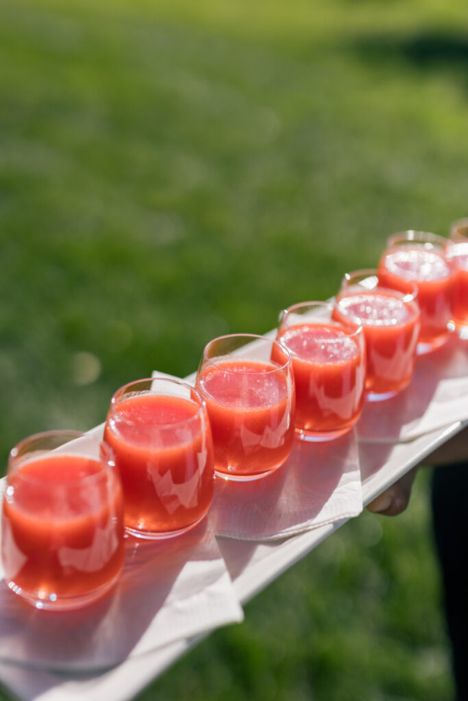 Chilled tomato gazpacho shooters served during cocktail hour at a wedding at Connemara House.