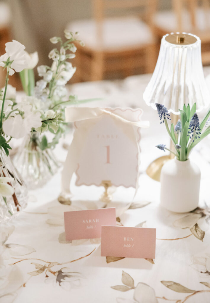 The prettiest kind of place setting—layered patterns, soft tones, and paper goods that feel like part of the design (not something added last minute)