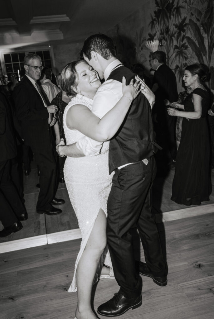 Couple slow dancing and embracing during a quieter moment on the dance floor