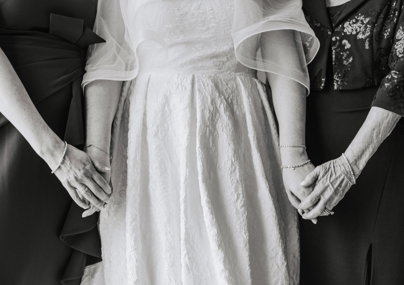 Close-up of textured wedding dress and veil, soft bridal detail styled by Newport wedding planner