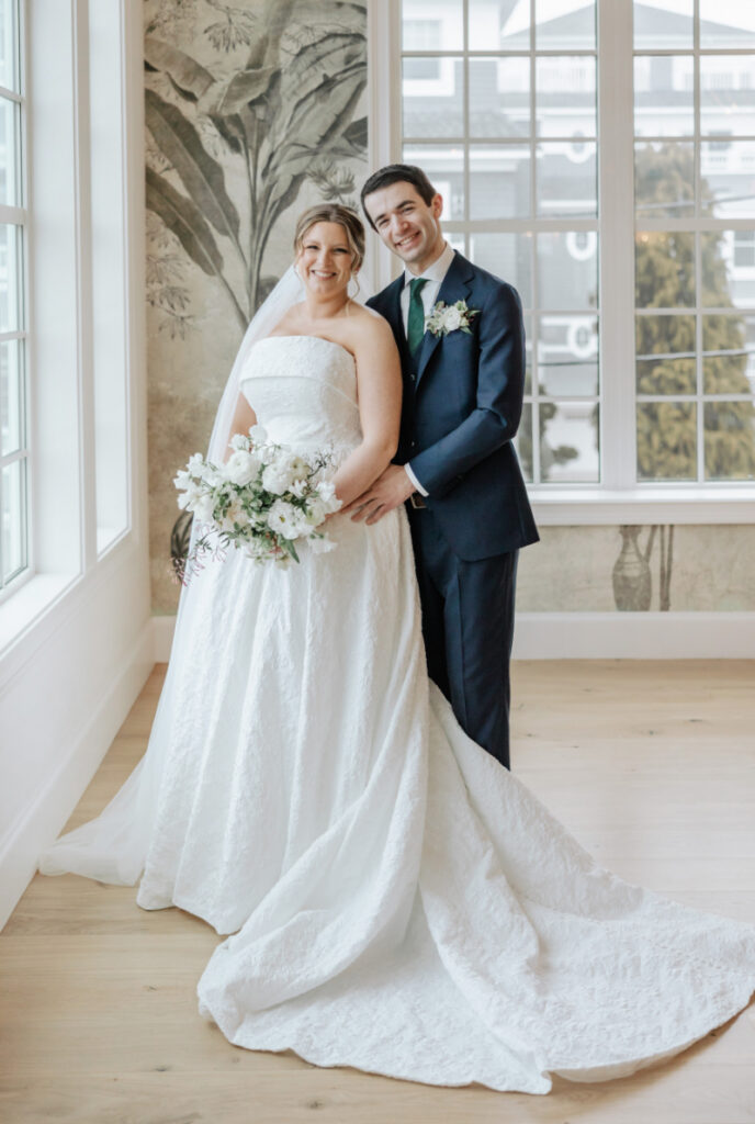 Bride and groom portrait by window light, classic and romantic moment at Newport wedding