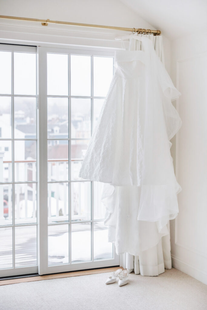 Wedding rings and invitation suite with soft florals, refined Newport wedding planner detail styling