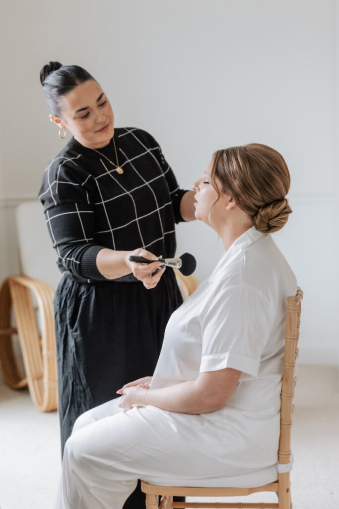 Bride getting ready with hair and makeup, calm morning moments styled by Newport wedding planner