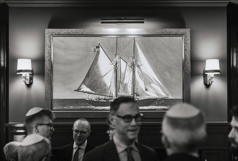 A moody, editorial moment layered with coastal artwork—bringing in that subtle nod to place without hitting you over the head with it