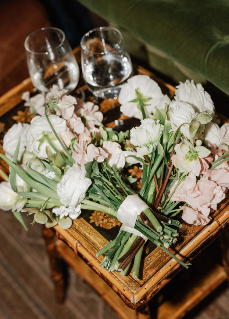 Bouquets set aside for the party ahead—soft, romantic, and proof that even the in-between moments deserve good design