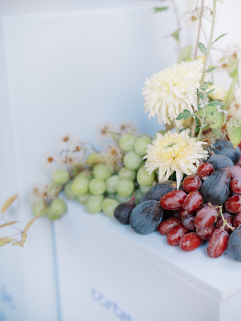 Wedding design ideas with grapes and figs styled as an organic, elevated table detail